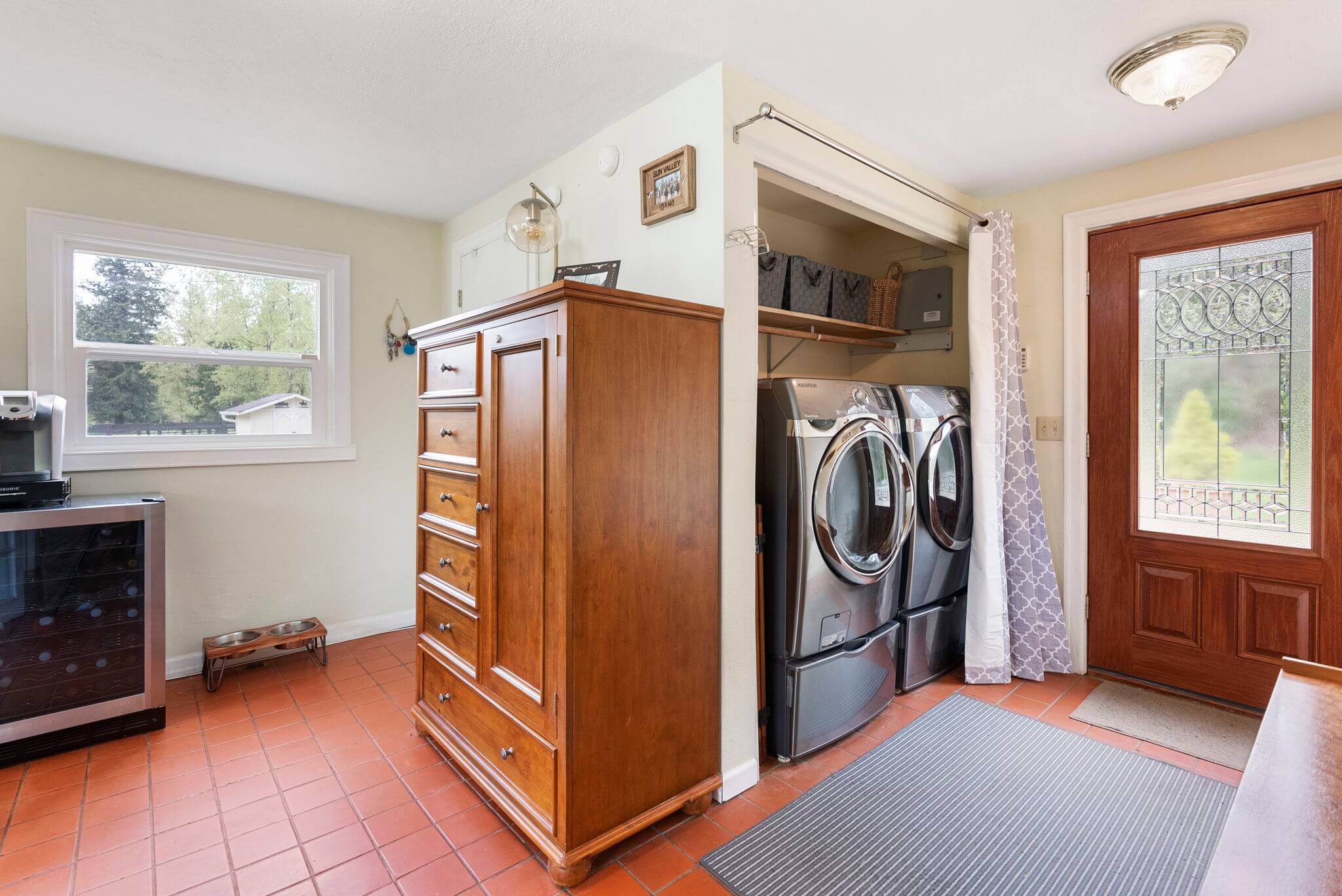 Home office includes a laundry area and door to back deck