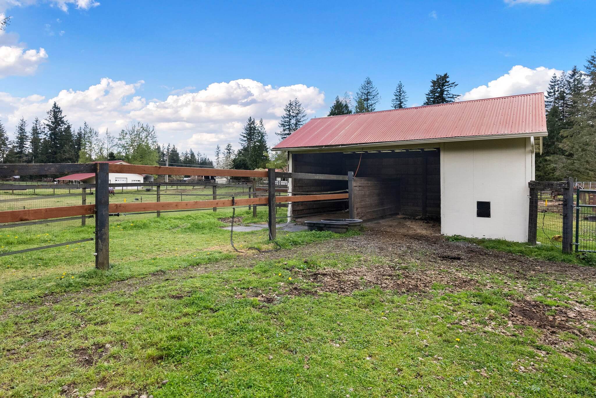 Second smaller barn with feed/tack room and two run-in stalls