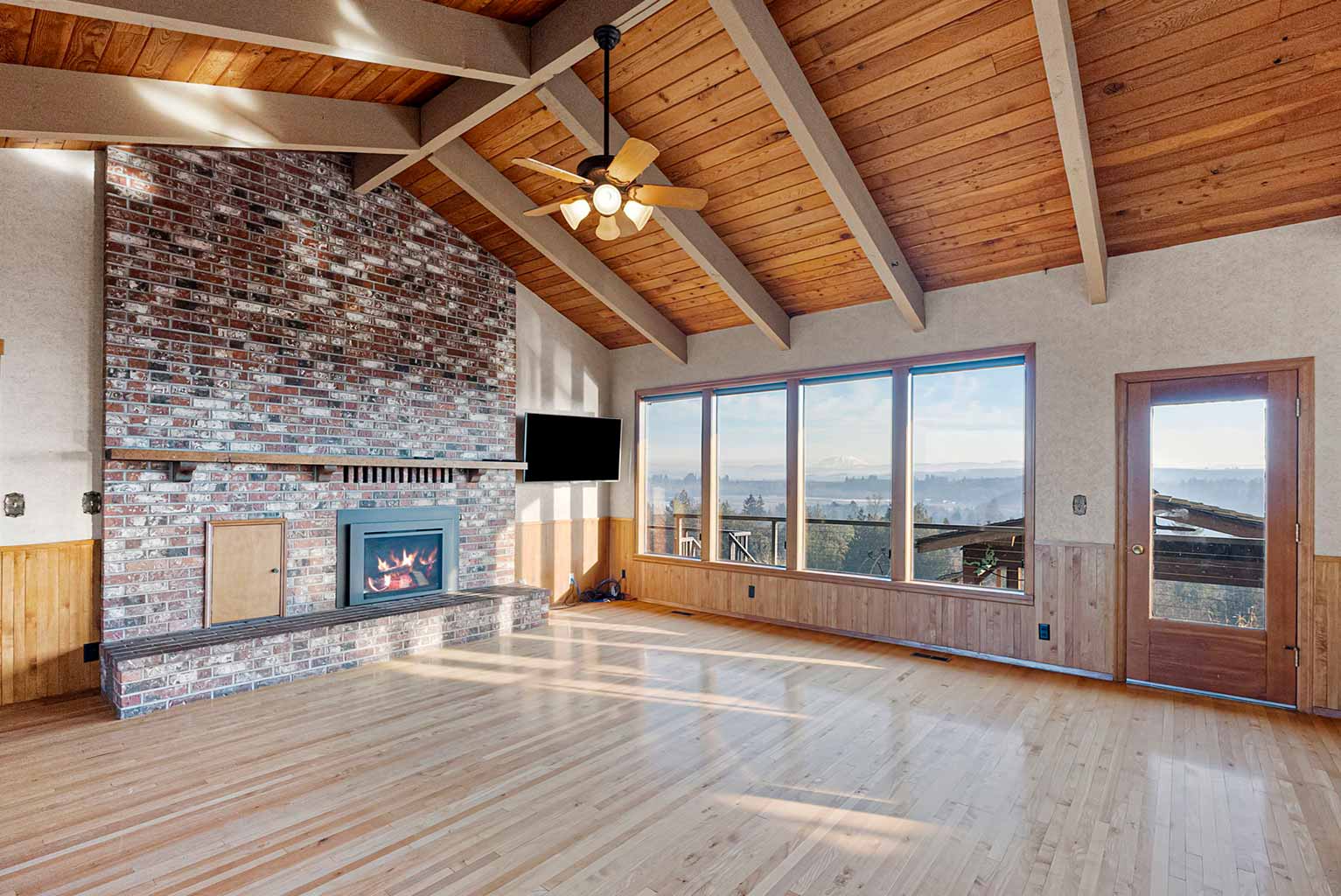 Impressive family room with vaulted ceiling and gas fireplace