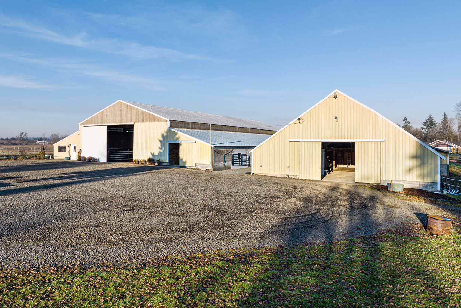 The smaller barn on the right has space for extra parking and hay storage